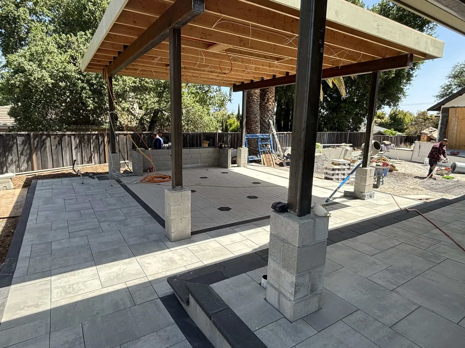 YV Masonry crew during a patio cover build